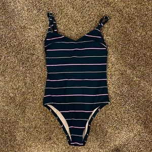 Navy blue striped one-piece swimsuit.